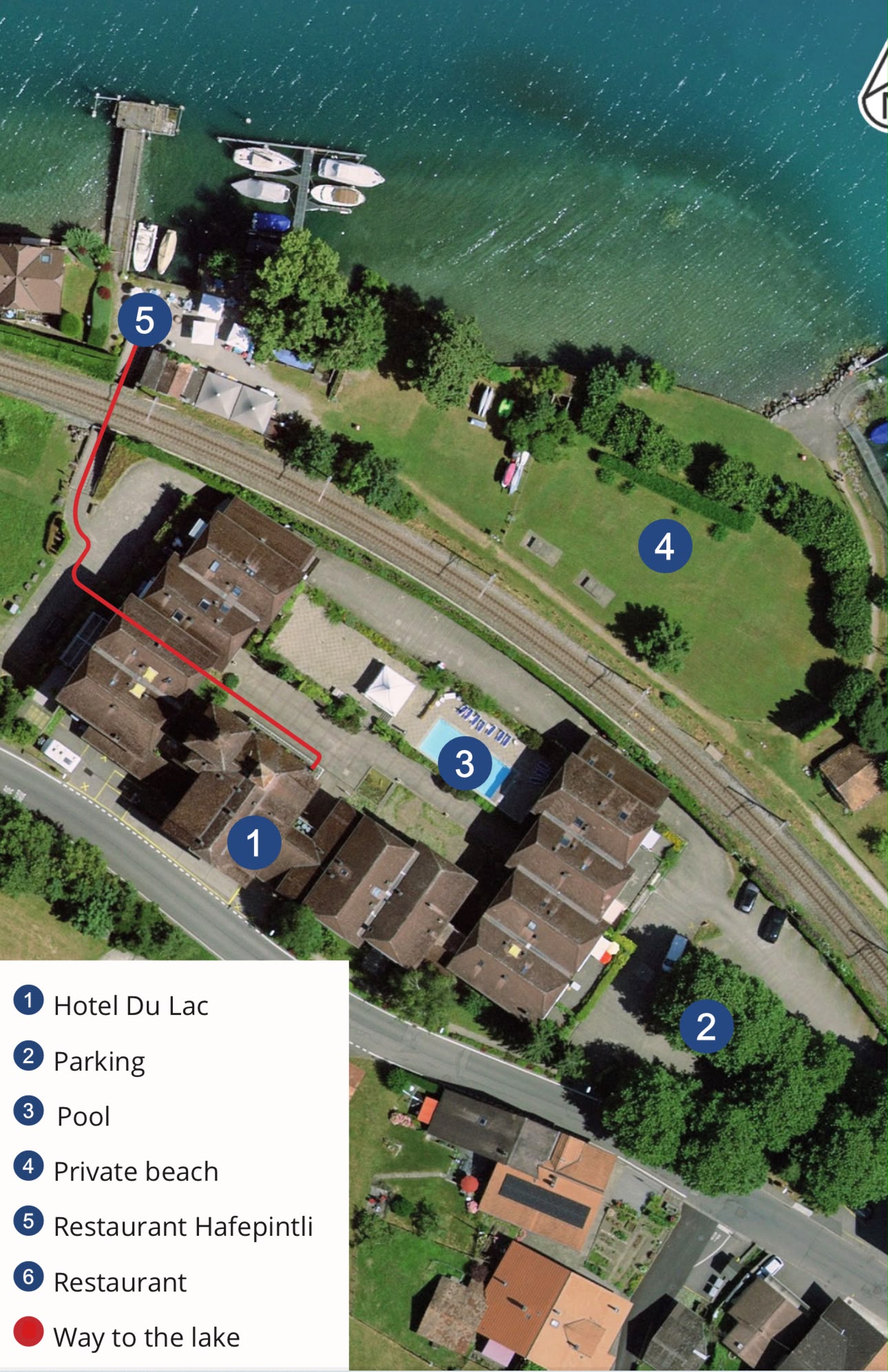 Orientation map showing Hotel Du Lac as 1, parking as 2, pool as 3, private beach as 4, and the red route to the lake